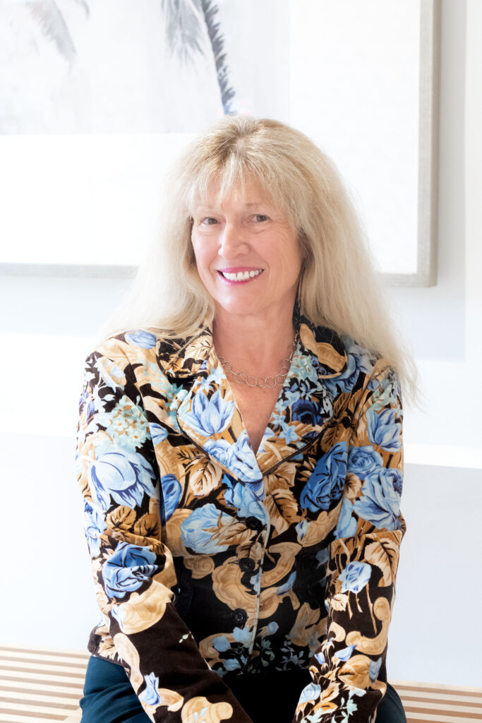 Dr. Lori Zaremski, PhD, LEP, seated and smiling in the lobby of The Light Center, a neuropsychological services practice in South Bay
