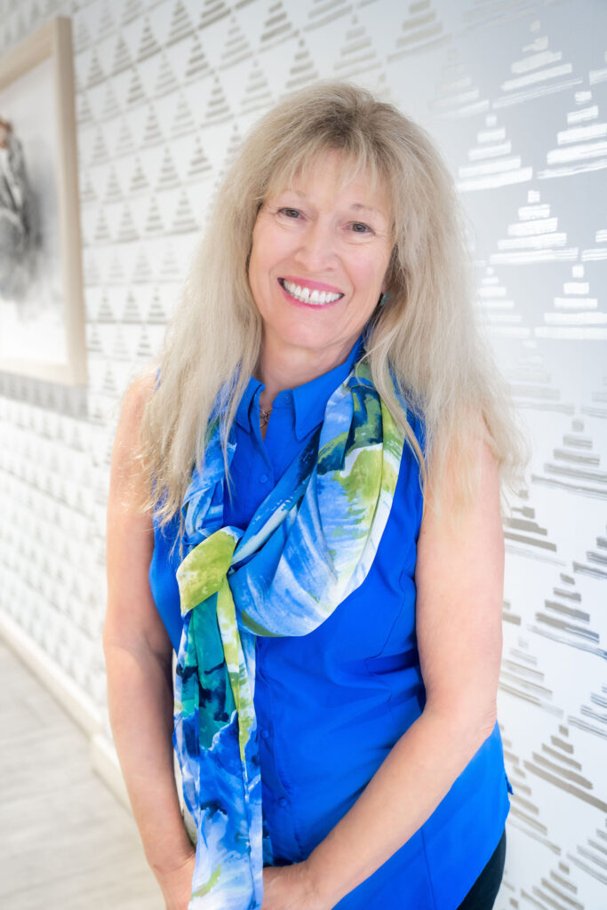Dr. Lori Zaremski, PhD, Licensed Educational Psychologist, smiling in a bright hallway at The Light Center in South Bay